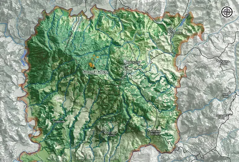 Topographic shaded relief map of the Brunello di Montalcino wine region in Tuscany. The area stands out in vibrant green against a desaturated grey background, showing mountain terrain, blue rivers and text labels for Montalcino and Castello Romitorio