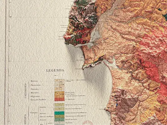 A sheet of cotton paper photographed at very close range with side lighting to highlight the paper's texture and the vivid ink print of a section of a map of Portugal