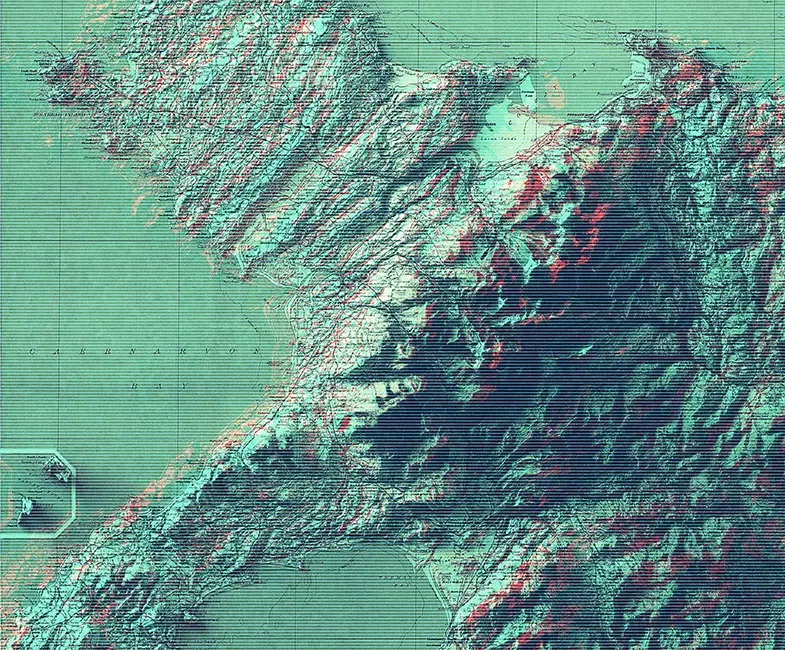 Detailed topographic relief map of North Wales and Caernarvon Bay. The coastal and mountainous landscape features fine shaded textures in teal and deep blue with red undertones, superimposed on a historic green grid map with old lettering
